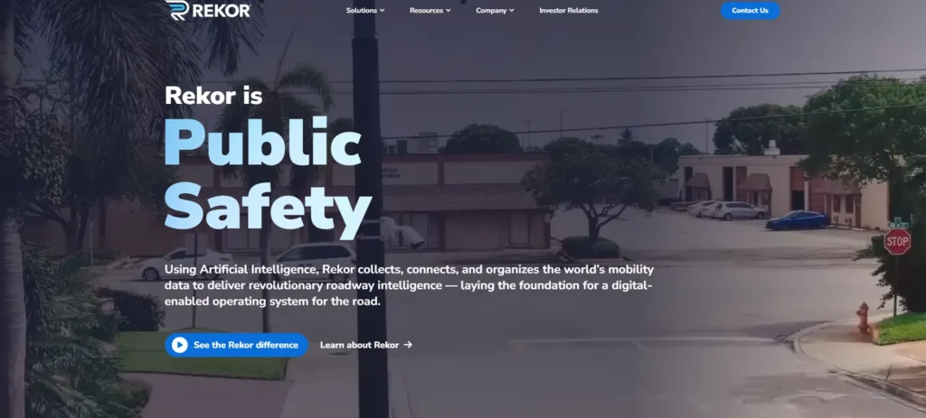 Screenshot of the Rekor homepage showing the headline “Rekor is Public Safety” over a street scene background.